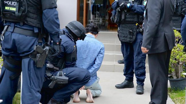 Tran is arrested by strike force officers during a raid of his Cabramatta home in June 2017. Picture: NSW Police