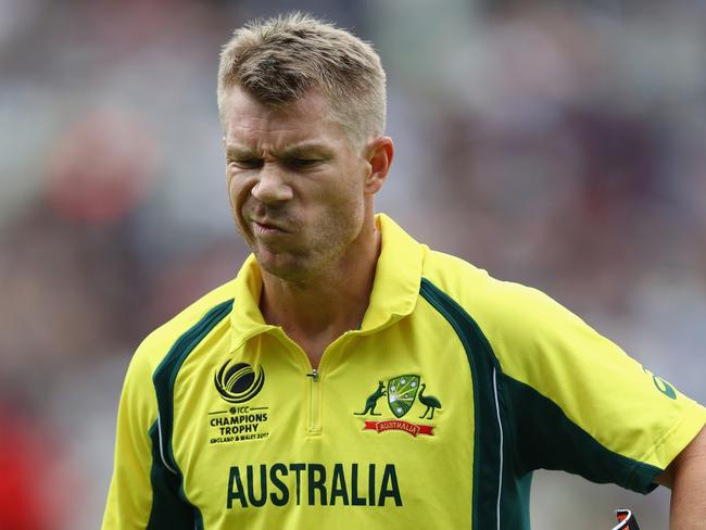 BIRMINGHAM, ENGLAND - JUNE 02:  David Warner of Australia heads back to the pavillion after being dismissed by Trent Boult for 18 runs during the ICC Champions Trophy match between Australia and New Zealand at Edgbaston on June 2, 2017 in Birmingham, England.  (Photo by Michael Steele/Getty Images)