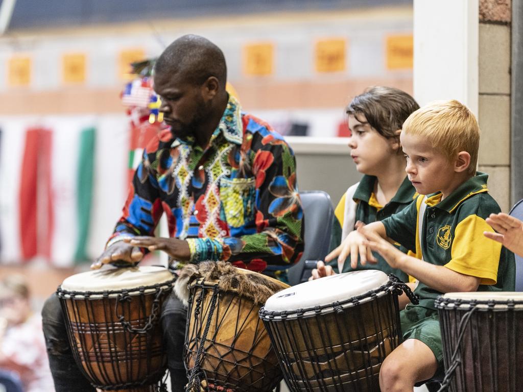 African drumming showcase participants (from left) Pasaka Mwibusa, Jessica Wyatt and Jayden Stevens during Harmony Day celebrations at Darling Heights State School. Picture: Kevin Farmer