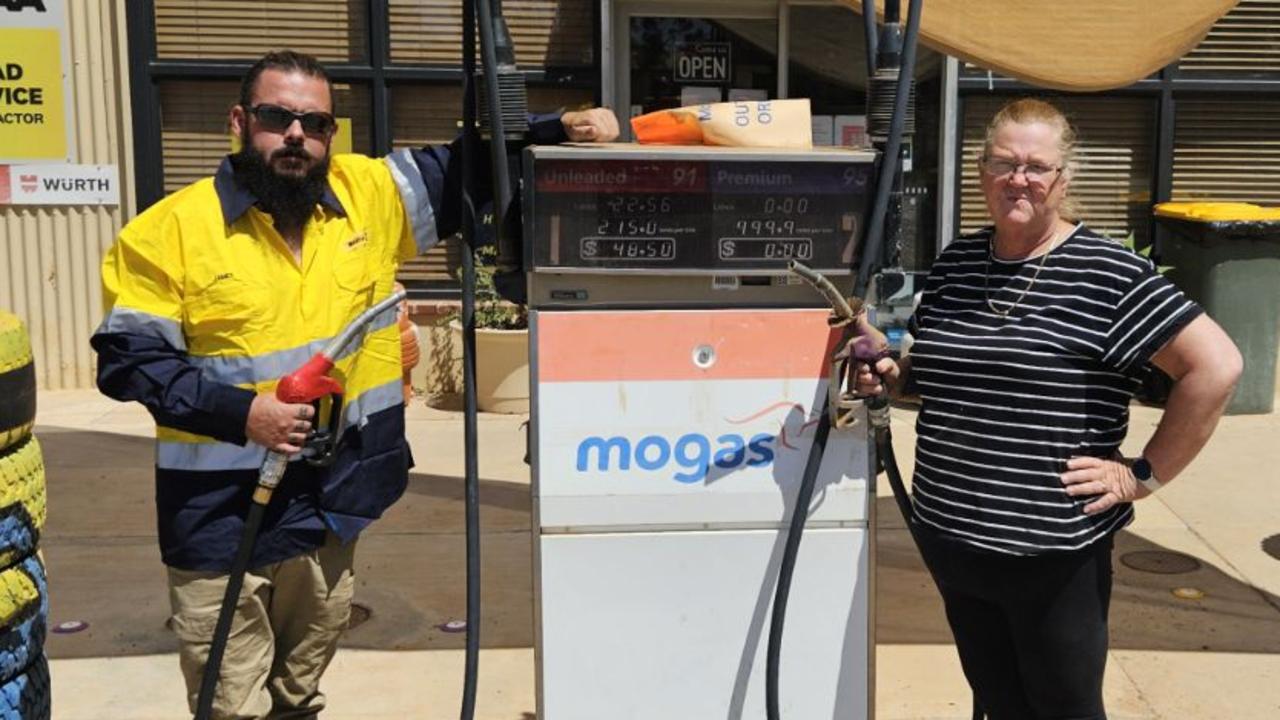 MOGAS Cookes Outback Motorsowner Kym Logan, pictured with local Jessie Evans, said the situation was dire for many of the residents. Picture: Supplied