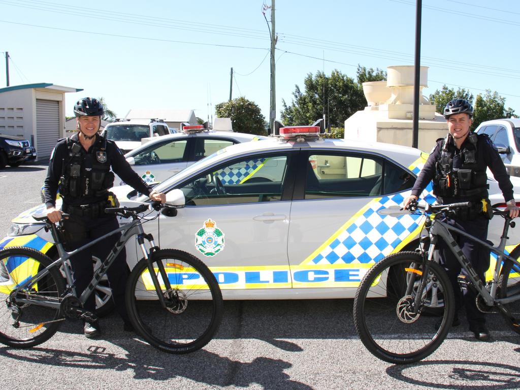 Gladstone Police constables Marcia Boyce and Jade Banks with two of the fleet of mountain bikes used by police in the region that were donated by Gladstone MP Glenn Butcher. Picture: Rodney Stevens