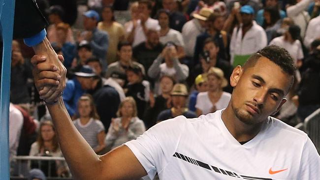 Nick Kyrgios shakes hands with the umpire after losing to Andreas Seppi. Picture: Wayne Ludbey