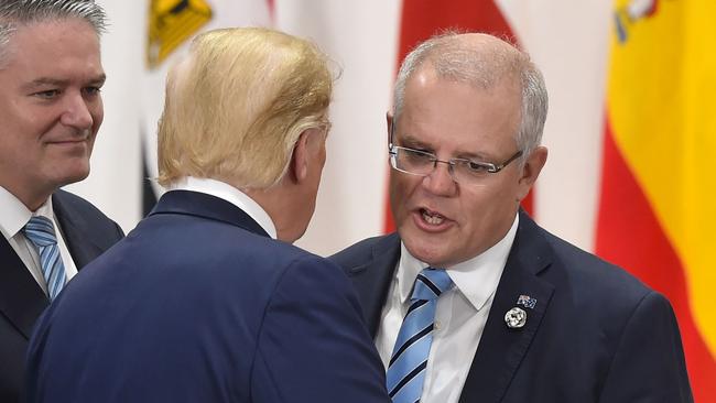 Trump speaks with Morrison in Japan. Picture: AFP