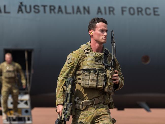 An Australian Army Officer from 1st Battalion, Royal Australian Regiment walks from a No 37 Squadron C-130J Hercules after arriving at RAAF Base Scherger for Exercise Northern Shield 2017. *** Local Caption *** Exercise Northern Shield 2017 (NS17) is an Australian Defence Force (ADF) training activity where high-readiness forces deploy quickly to remote locations in Australia in response to a simulated incident. This year, NS17 involves a civilian evacuation scenario from a fictitious state that is based on the North Queensland region. This exercise is designed to enable the Australian Defence Force to practice and participate in supporting an Australian Whole-of-Government response.  A wide range of Australian Defence Force capabilities and personnel have been brought together for this short notice exercise to demonstrate Defence’s ability to respond to any contingency in the region and provide an agile, decisive and effective deterrent to any future incidents.