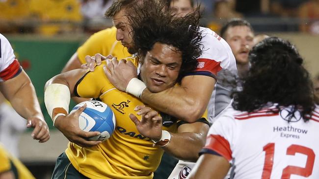 United States' Louis Stanfill, back, tackles Australia's Tatafu Polota-Nau, front, during the second half of an international rugby test match at Soldier Field, Saturday, Sept. 5, 2015, in Chicago. Australia won 47-10. (AP Photo/Kamil Krzaczynski)