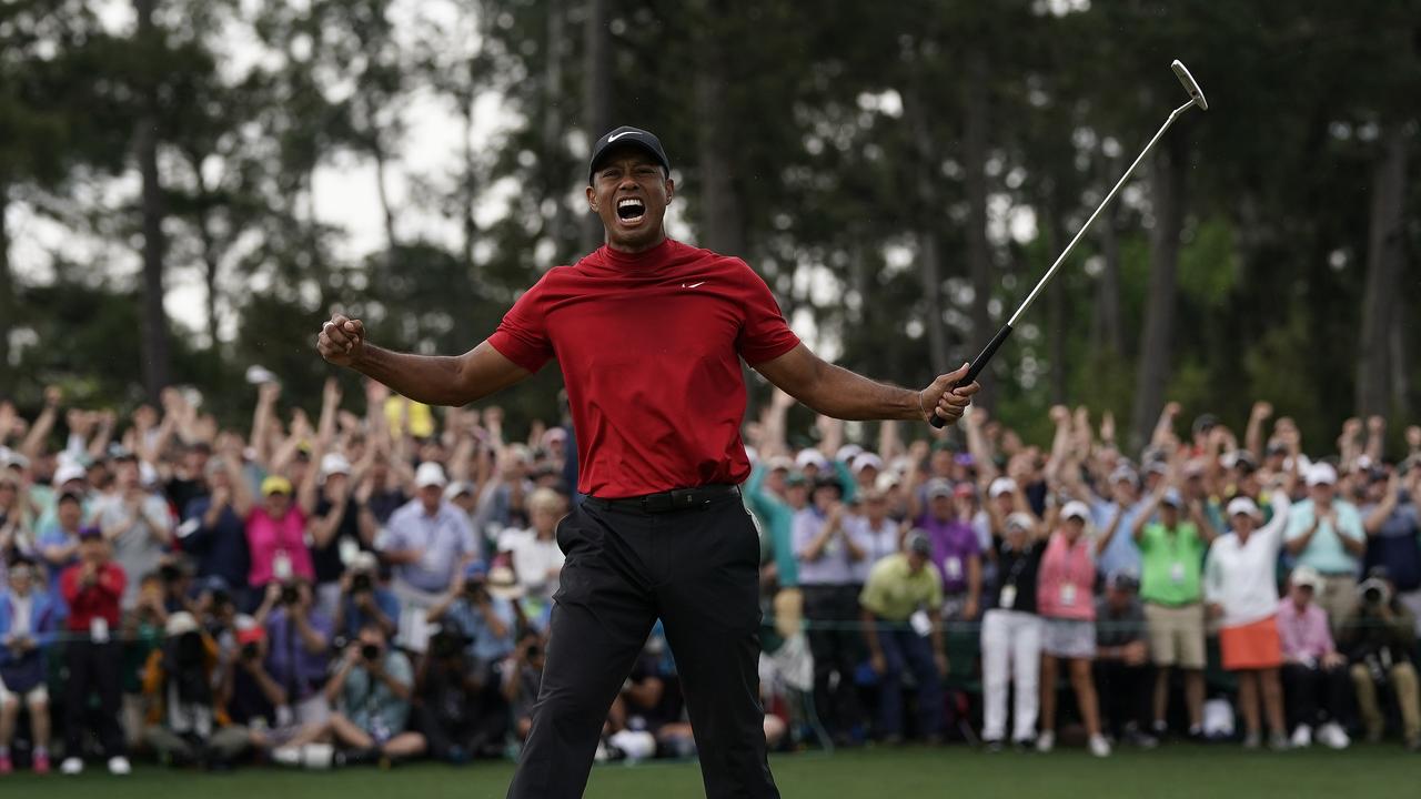 Tiger Woods reacts after the winning putt at the Masters.