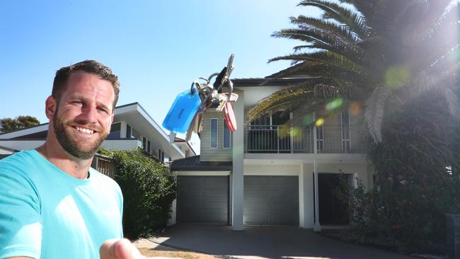 Hometime Qld Manager Shane Flanagan is one of many exclusive Air BnB real estate agents that have sprung up on the Gold Coast. Shane with the keys to someone’s next Gold Coast holiday. Picture Glenn Hampson