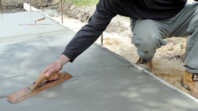 The Queensland Building and Construction Commission is warning people not to engage the services of unlicensed concreter Jacob Moratti, who is operating in the state. Picture: generic concrete laying (not Jacob Moratti pictured)