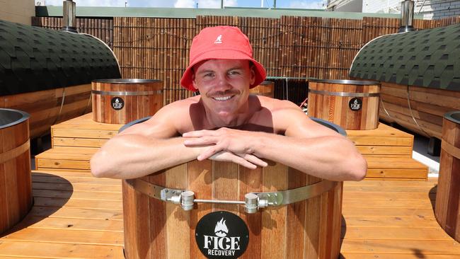 Owner and boxer Darragh Foley has opened his own recovery centre, hidden away in the heart of Burleigh Heads, and he says it's special features makes it unique. Darragh in one of the six icebaths with giant Saunas on either side. Picture: Glenn Hampson