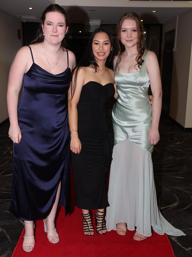 MELBOURNE, AUSTRALIA – JUNE 14 2024 Izabelle Williams, May Krutbangyang and Aliza Cervi attend the Lowanna College Senior Formal 2024 at the Moe Racing Club Picture: Brendan Beckett