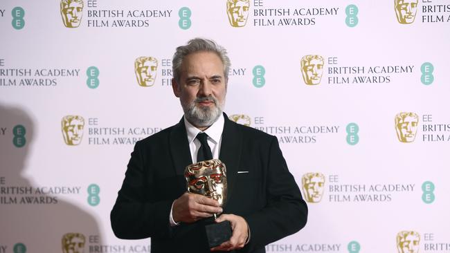 Sam Mendes poses with the best director award for 1917 backstage at the Bafta awards. Picture: Joel C Ryan/Invision/AP.