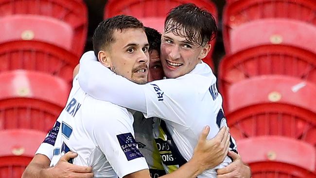 Central Coast Mariners players celebrate with striker Jordan Murray (left) after he scored against the Jets. Picture: Getty Images