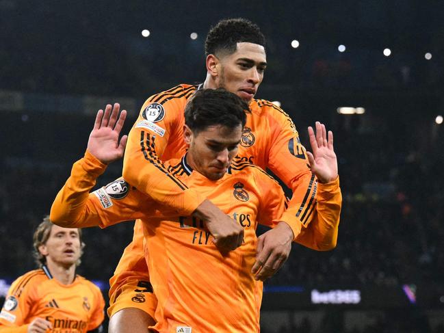 Real Madrid's Moroccan forward #21 Brahim Diaz (C) celebrates after scoring his team second goal during the UEFA Champions League football match between Manchester City and Real Madrid at the Etihad Stadium in Manchester, north west England, on February 11, 2025. (Photo by Oli SCARFF / AFP)