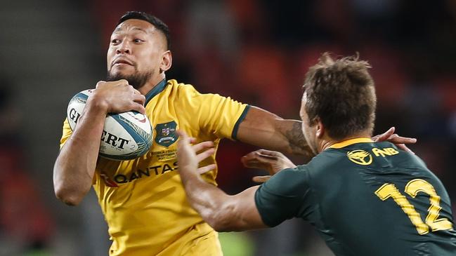 Israel Folau (L) vies for the ball with South Africa's centre Andre Esterhuizen during the Rugby Championship match between South Africa and Australia in Port Elizabeth, South Africa last September.