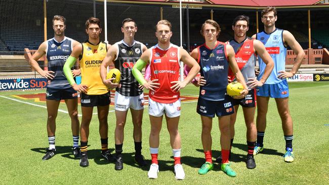 Keegan Brooksby (South Adelaide), Cameron Buchanan (Glenelg), Sam Davison (Port Adelaide), Michael Virgin (North Adelaide), Chris Olsson (Norwood), Lochie Peter (West Adelaide) and Tom Read (Sturt) pose for a photograph at the Norwood Oval, Norwood, Adelaide on Friday the 2nd of February 2018. The SANFL Fast Footy pre-season competition is Friday the 9th and Saturday the 10th of February at Norwood Oval. (AAP/ Keryn Stevens)