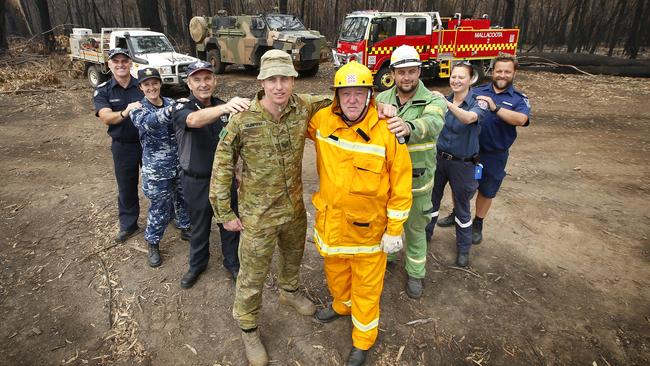 Emergency services band together to get the towns cut off from the fires back on the road to recovery. Picture: David Caird