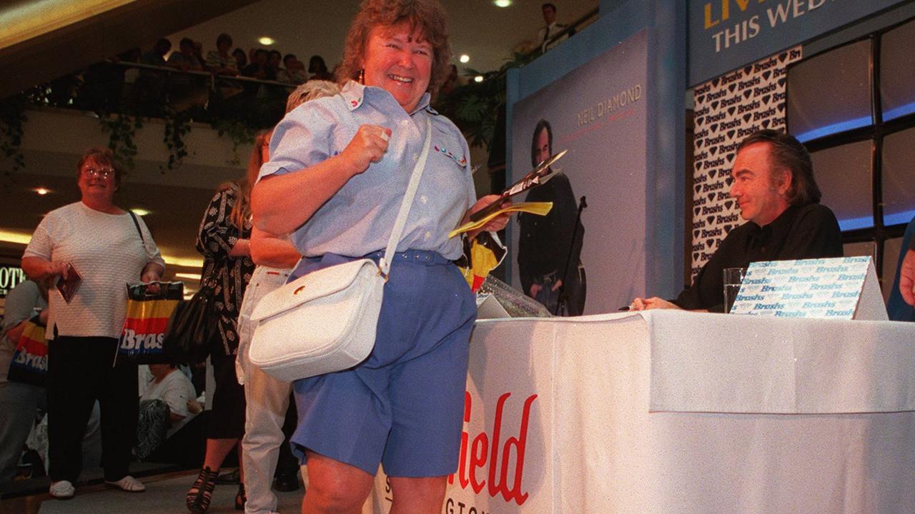 An elated woman exits the stage after meeting Neil Diamond in 1995. The I Get a Kick Out of You and I Left My Heart in San Francisco singer, who is now 95, showed why he is such a legend and naturally attracted a throng of adoring fans. Picture: Troy Bendeich