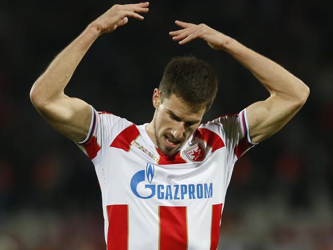 Red Star's Milos Degenek gestures as he asks for support from his fans during the Champions League group C soccer match between Red Star and Liverpool at the Rajko Mitic stadium in Belgrade, Serbia, Tuesday, Nov. 6, 2018. (AP Photo/Marko Drobnjakovic)