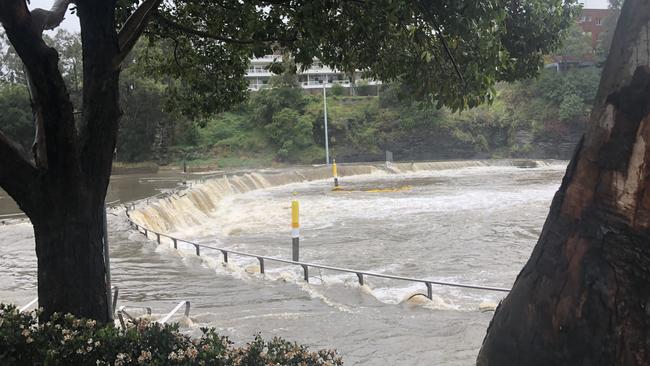 Water cascades down Parramatta Weir.