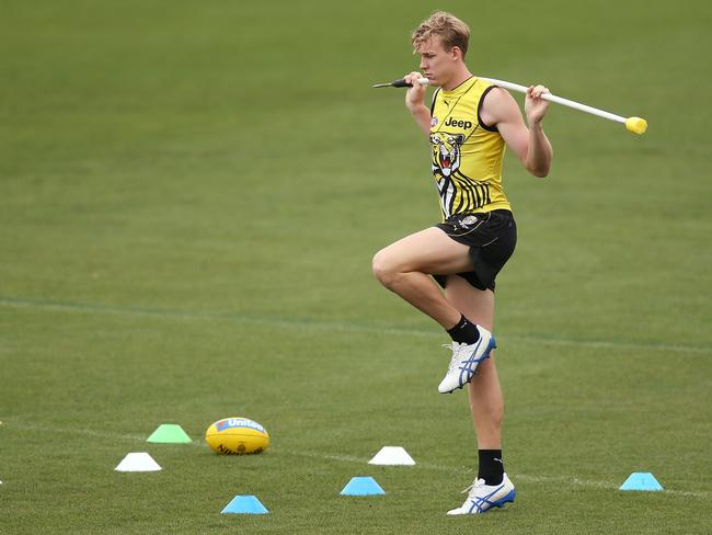 Tom Lynch of the Tigers, hoping to play round one after coming back from injury, performs a running drill by himself during the Richmond Tigers AFL training session at Punt Road Oval on March 19, 2019 in Melbourne, Australia. (Photo by Michael Dodge/Getty Images)