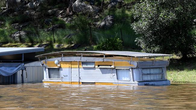 A caravan is submerged by floodwater at Sackville North, NSW. Picture: Bianca De Marchi