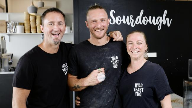 First year apprentice baker Rick Schwarz of Wild Yeast bakery, Trinity Beach, has placed third in the Certificate III baking category in the Baking Industry Training Australia awards. Rick Schwarz (centre) with Wild Yeast FNQ Co owners Chris Schwarz and Alicia Schwarz. Picture: Brendan Radke