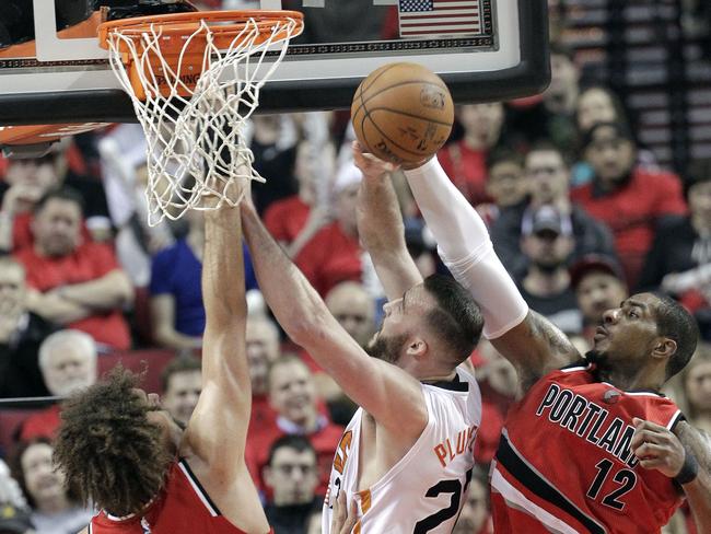 Portland’s LaMarcus Aldridge rejects a shot from Suns center Miles Plumlee.