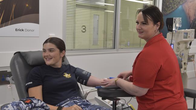 Flying Officer Sophie Lanson with Zoe Ross before giving blood. Picture: Harry Brill.