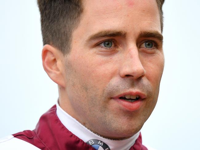 Jockey Adam Hyeronimus looks on after riding Shout The Bar to victory in race 7, the Vinery Stud Stakes, during Stakes Day at Rosehill Gardens Racecourse in Sydney, Saturday, March 28, 2020. (AAP Image/Dan Himbrechts) NO ARCHIVING, EDITORIAL USE ONLY