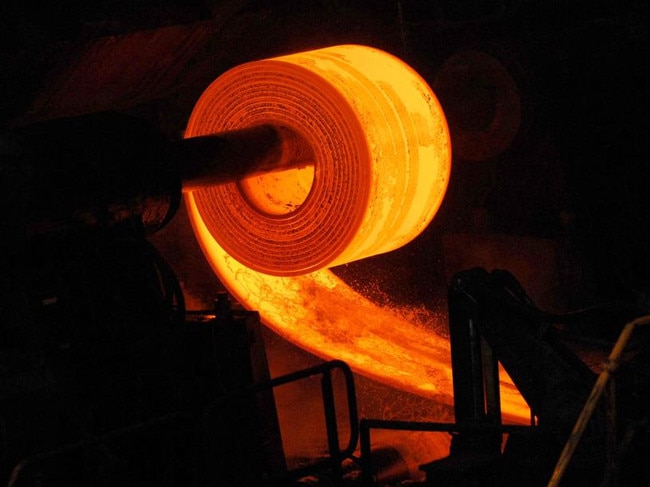 Hot roll coils are formed in the Hot Strip Mill during the manufacturing of steel at BlueScope Steel Ltd.'s Port Kembla Steelworks, in Port Kembla, outside Sydney, Australia, on Thursday, Sept. 17, 2009. BlueScope Steel Ltd. is Australia's largest steelmaker. Photographer: Jeremy Piper/Bloomberg