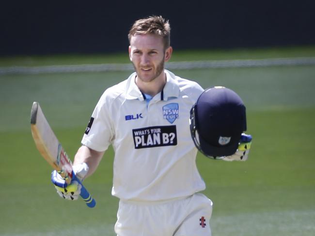 Peter Neville celebrates reaching 100 runs. Picture: KIM EISZELE