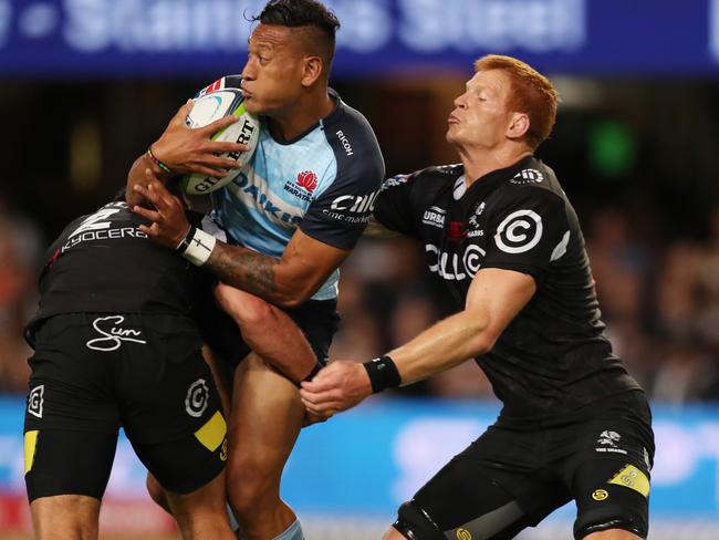 Israel Folau finds it tough to break through the Sharks’ defensive line.