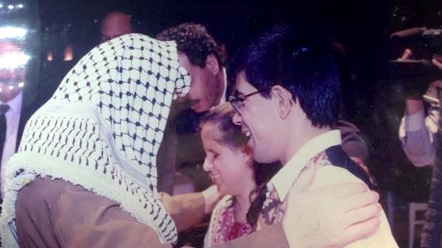 Yasser Arafat is pictured with a young Dalal Altaji and her brother Badr Arafat.