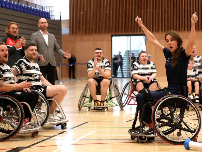 The princess with members of the England team. Picture: AFP