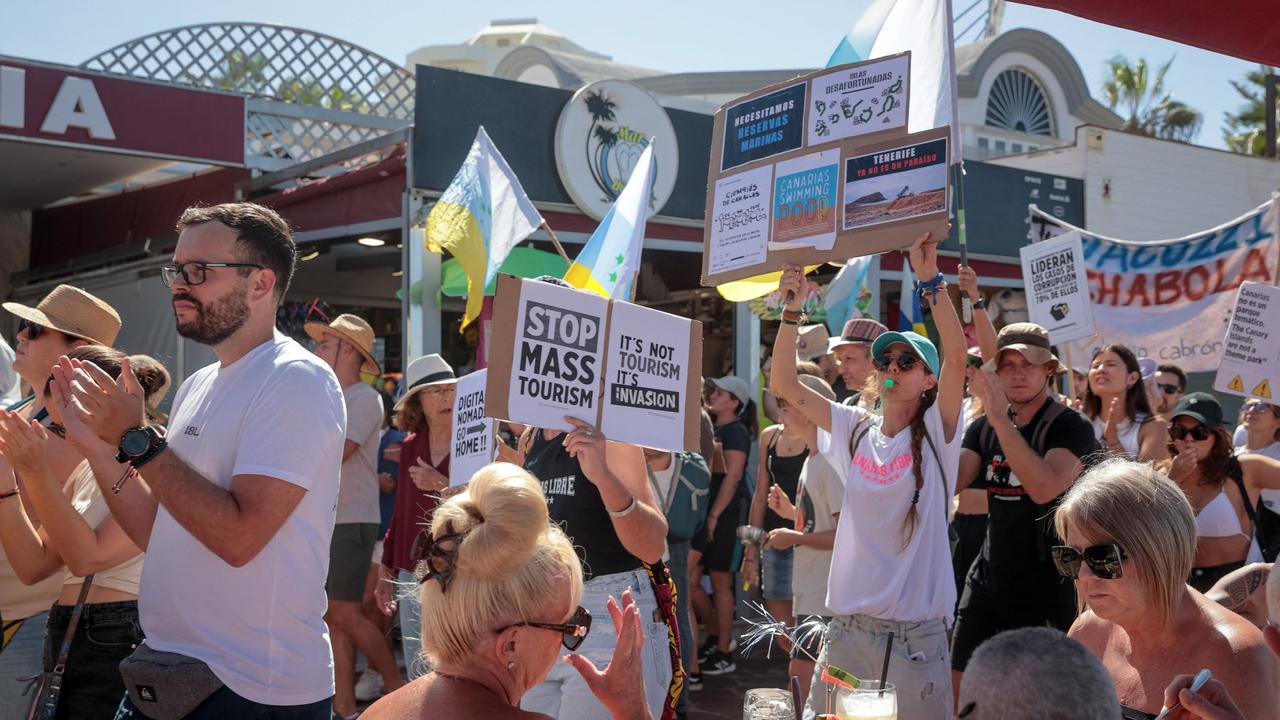Protesters march during demonstration against mass tourism. Picture: Desiree Martin/AFP