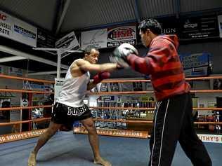 IN THE RING: Dr Lanziz Homar works the pads with Jack Asis at Smithy's Gym ahead of his Saturday night fight. Picture: Bev Lacey