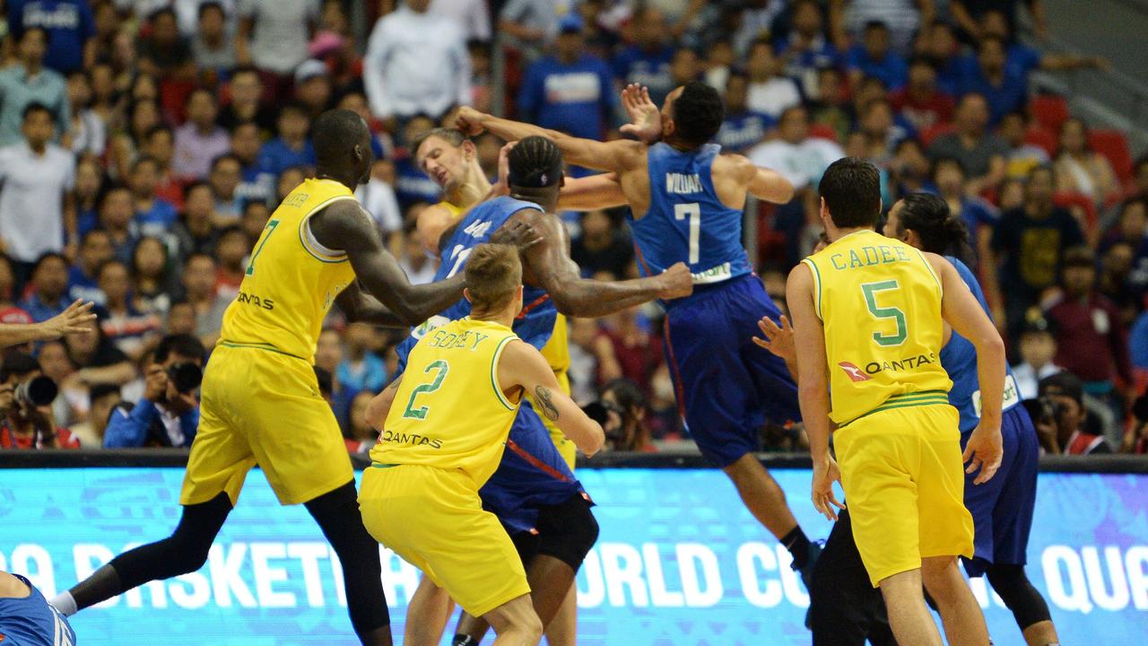 Australia’s Daniel Kickert cops a wild punch during the scary brawl against the Philippines five years ago. Picture: AFP