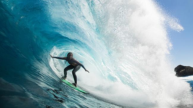 High school student Lizzie Stokely hits Shipstern Bluff for a barrel of ...