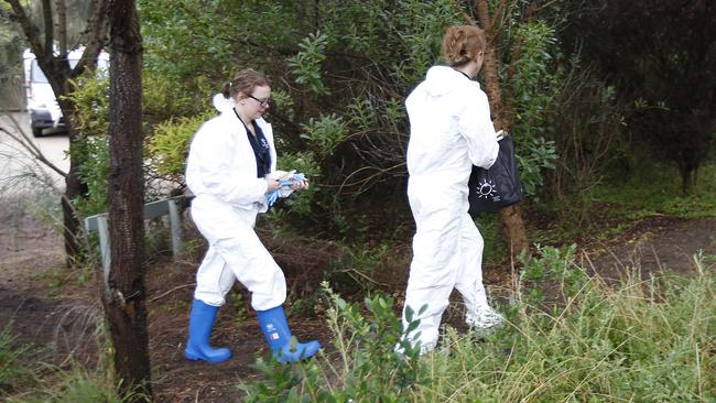 Forensic police officers search the Diamond Bay area near where Joanne Martell’s body was found in January 2017. Picture: David Caird