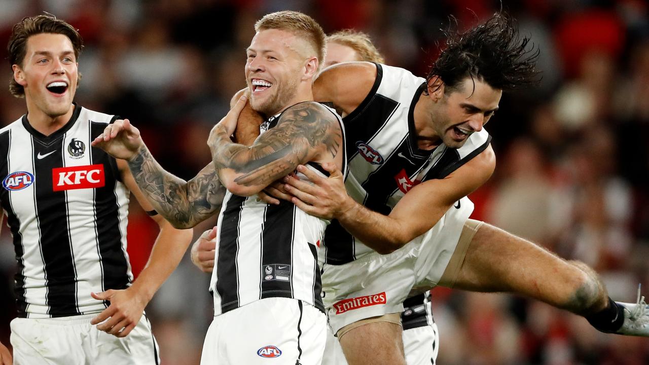 MELBOURNE, AUSTRALIA - MARCH 18: Jordan De Goey of the Magpies celebrates a goal with Brodie Grundy of the Magpies during the 2022 AFL Round 01 match between the St Kilda Saints and the Collingwood Magpies at Marvel Stadium on March 18, 2022 In Melbourne, Australia. (Photo by Dylan Burns/AFL Photos via Getty Images)