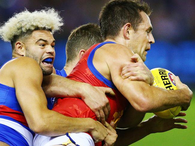 Luke Hodge tries to break a tackle agains the Bulldogs last weekend. Picture: Getty Images