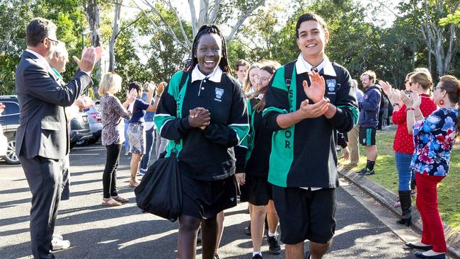 Bray Park State High School staff welcome back their year 12 students with a socially distanced guard of honour after COVID-19 restrictions are eased. Agyo Majorand Kynan Elford lead the groupinto school. Picture: Renae Droop/RDW Photography