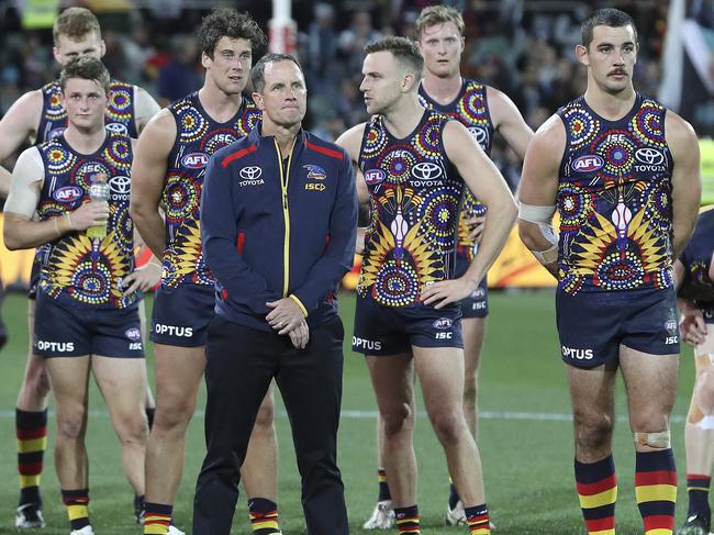 The dejected Crows, including coach Don Pyke, stand together after their 57-point loss in Showdown 47. Picture: Sarah Reed