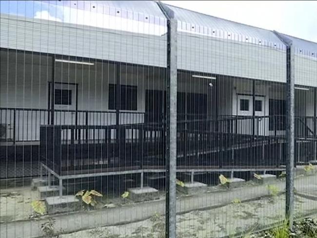 FILE - In this file photo made from Australia Broadcasting Corporation video taken on Tuesday, Oct. 31, 2017, shows housing of asylum seekers protesting the possible closure of their detention center, on Manus Island, Papua New Guinea. New Zealand's prime minister has repeated her country's offer to take 150 refugees from an Australian immigration camp in Papua New Guinea where more than 600 weakened men are continuing a standoff with authorities. (Australia Broadcasting Corporation via AP, File)