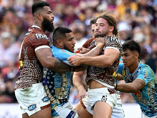 Moeaki Fotuaika takes on Payne Haas and Pat Carrigan. Picture: Bradley Kanaris/Getty Images