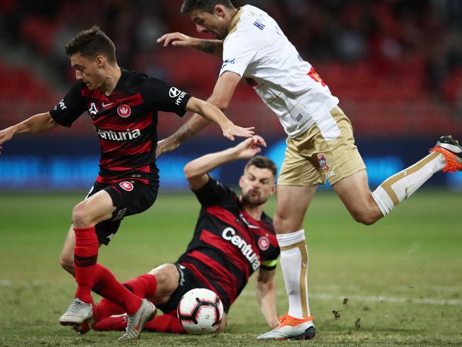 Jason Hoffman of the Jets (right) competes for the ball with the Wanderers’ Brendan Hamill (centre) and Jordan O’Doherty (left) on Friday night. Picture: Getty Images