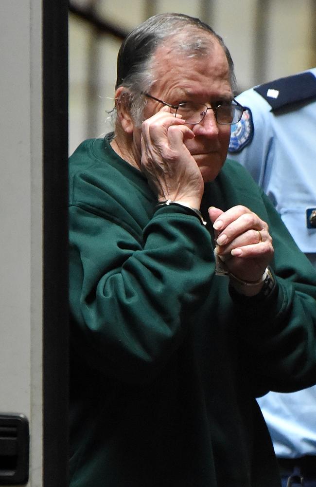 Gregory Keith Davies is led into the Melbourne Supreme Court for a pre-sentence plea hearing after pleading guilty to the 1984 rape and murder of six-year-old Kylie Maybury. Picture: Nicole Garmston