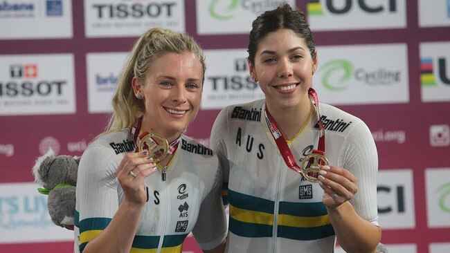 Annette Edmondson, of Adelaide, and Georgia Baker, of Tasmania with the Madison gold medals they won at the World Cup track cycling in Brisbane. Picture: JOHN VEAGE