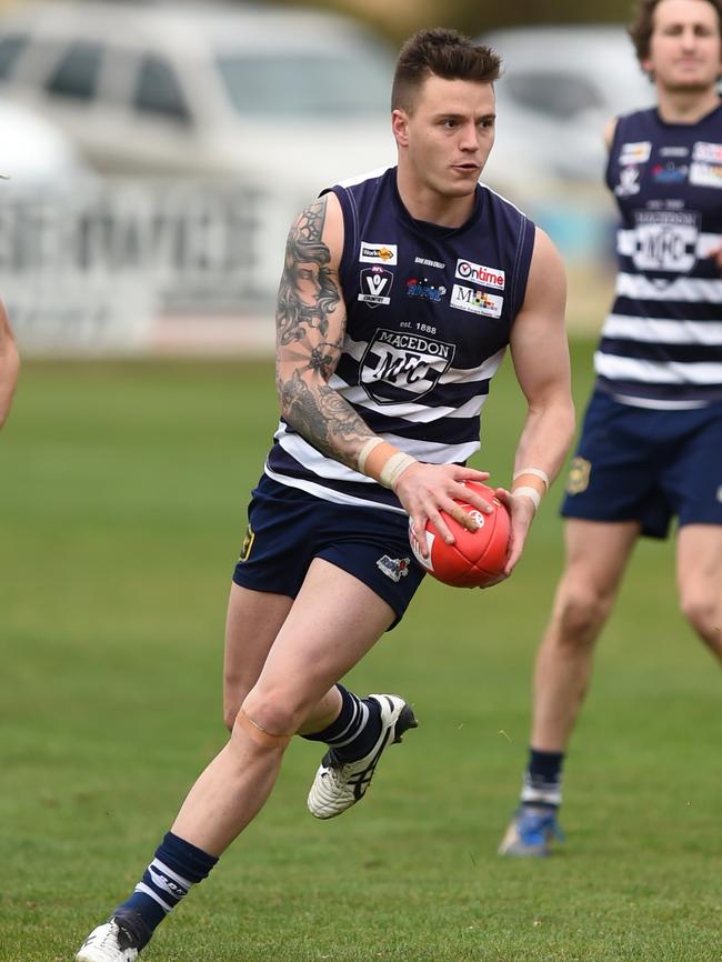 Jason Cooke streams forward for Macedon. Picture: David Smith.