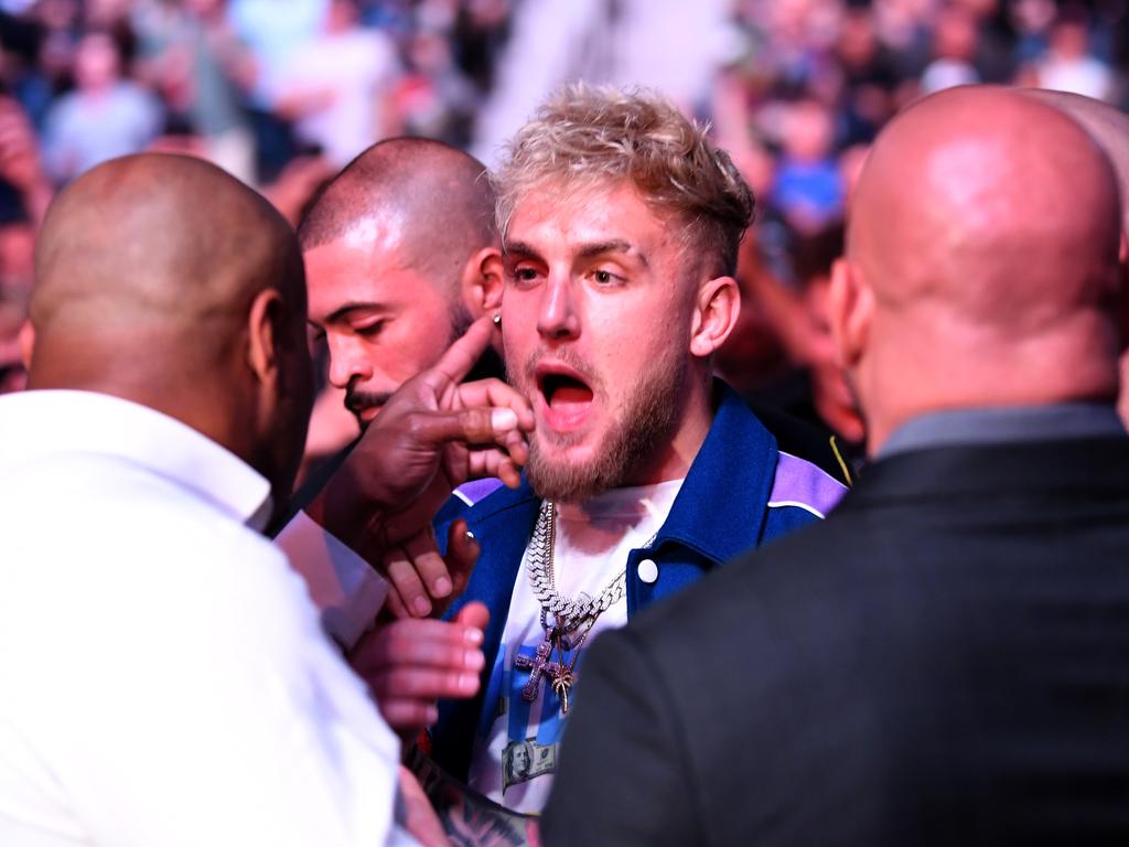 Daniel Cormier interacts with Jake Paul during the UFC 261 event. (Photo by Josh Hedges/Zuffa LLC)